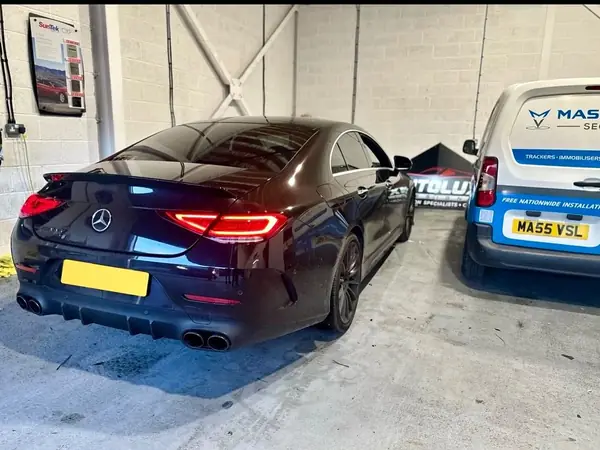 Mercedes CLS beside the Mass Vehicle Security van in the workshop